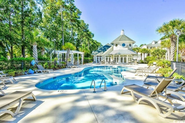 view of swimming pool featuring a patio area