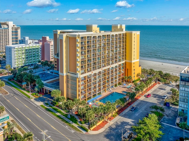 aerial view with a water view and a view of the beach