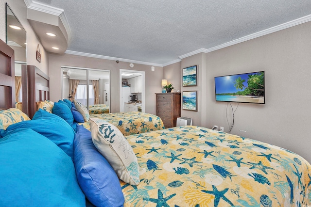 bedroom featuring a textured ceiling, a closet, and crown molding