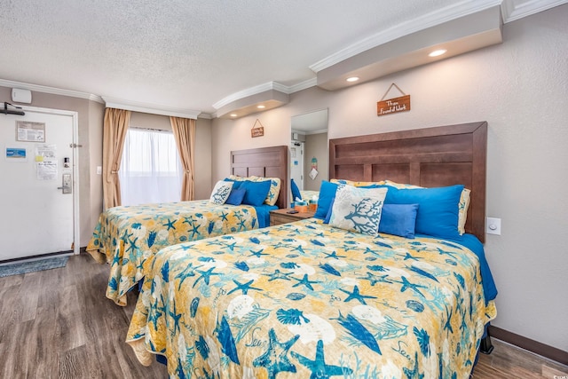 bedroom with a textured ceiling, dark hardwood / wood-style flooring, and crown molding