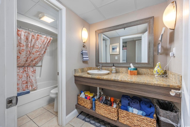 full bathroom with tile patterned flooring, toilet, shower / bath combo with shower curtain, and sink