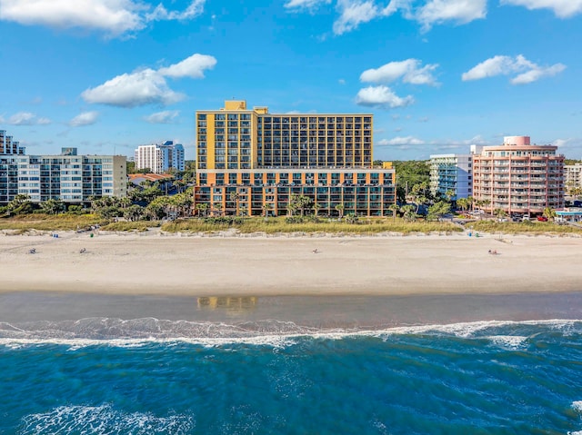 aerial view featuring a view of the beach and a water view