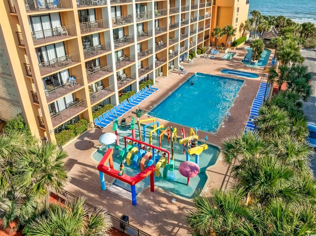 view of swimming pool featuring a water view