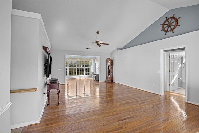 living room featuring wood-type flooring, high vaulted ceiling, and ceiling fan