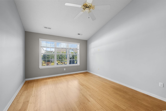 unfurnished room featuring ceiling fan, light hardwood / wood-style floors, and lofted ceiling