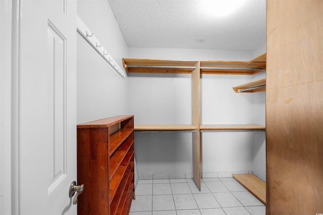 spacious closet with light tile patterned flooring