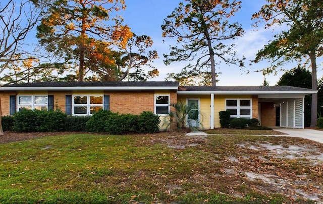 ranch-style home with a carport and a front yard