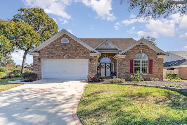 view of front of property featuring a front yard and a garage