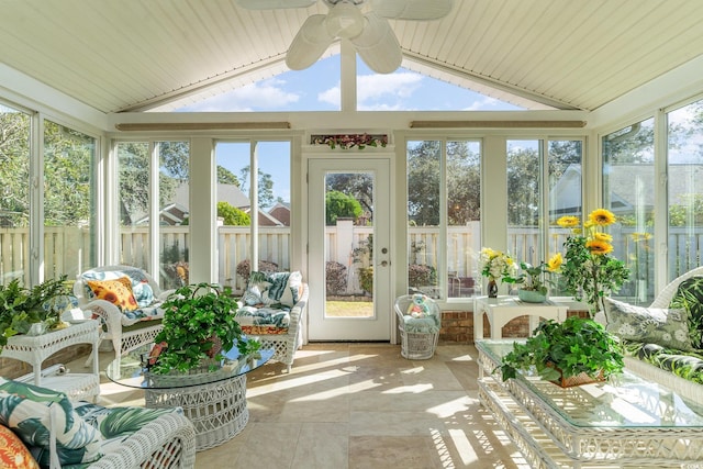 sunroom with ceiling fan and lofted ceiling