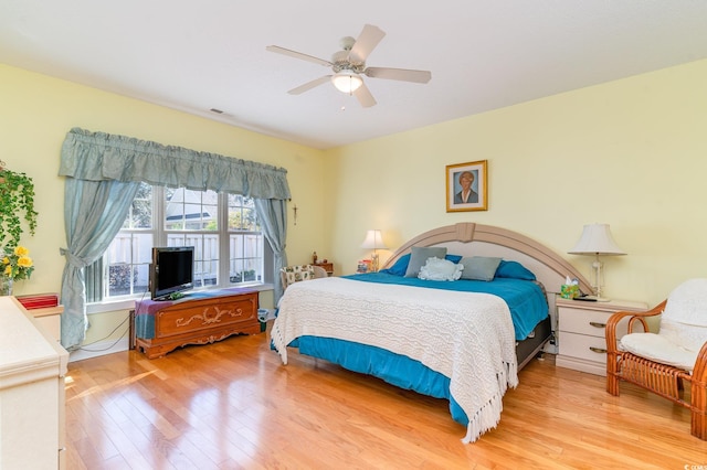 bedroom with ceiling fan and light hardwood / wood-style flooring