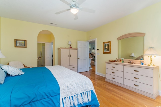 bedroom with ceiling fan and light hardwood / wood-style floors