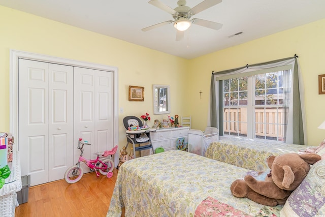 bedroom featuring ceiling fan, a closet, and hardwood / wood-style flooring