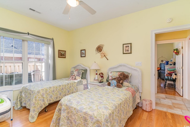 bedroom featuring ceiling fan and hardwood / wood-style floors