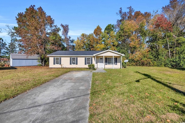 single story home featuring a porch and a front yard