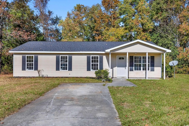 single story home with covered porch and a front yard