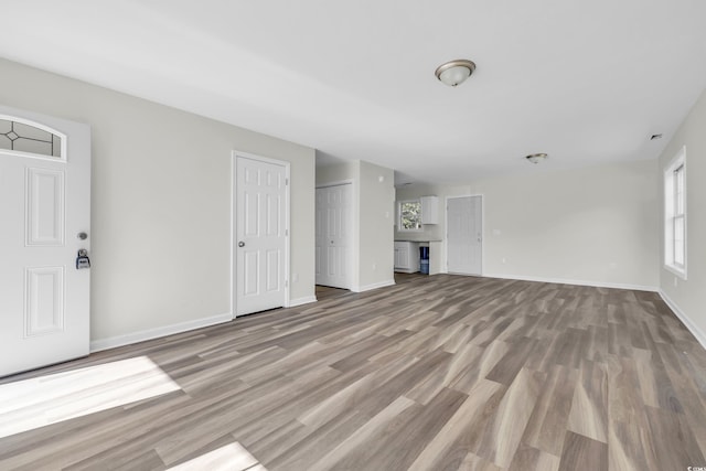 unfurnished living room featuring light hardwood / wood-style flooring