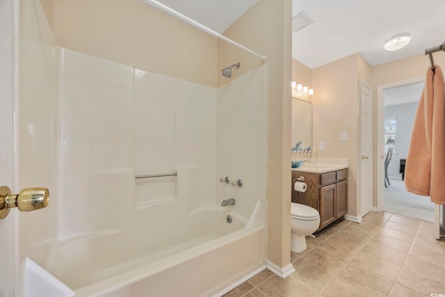 full bathroom featuring washtub / shower combination, vanity, and toilet