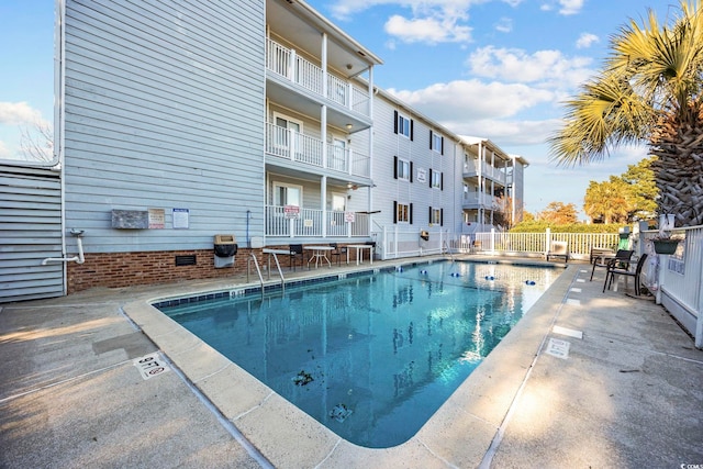 view of swimming pool featuring a patio