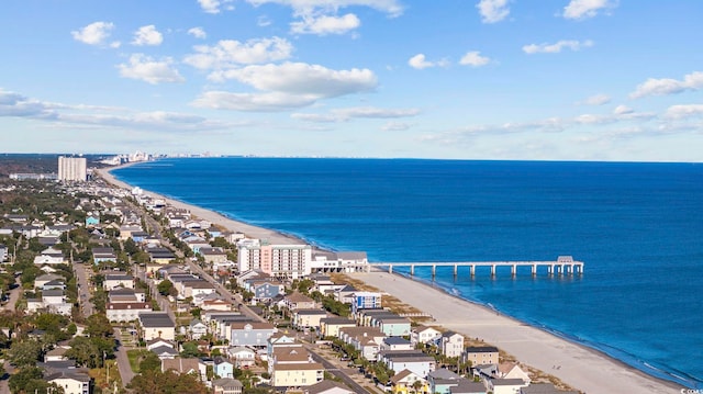 birds eye view of property with a beach view and a water view