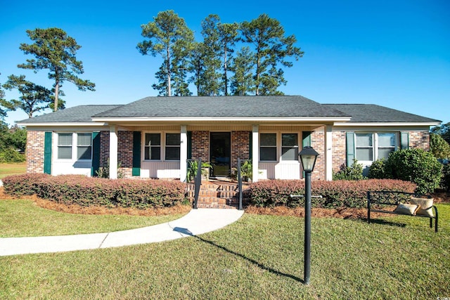 ranch-style house with a porch and a front yard