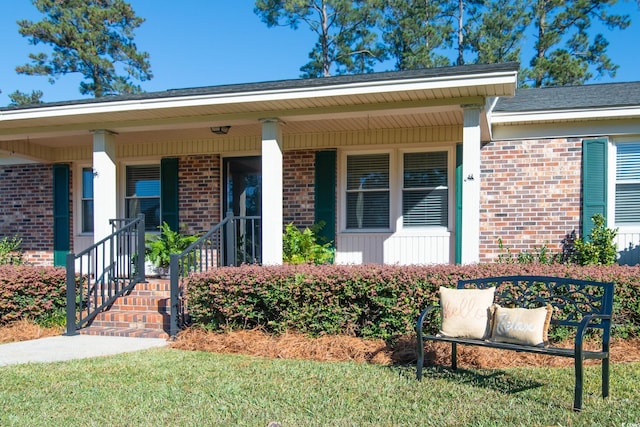 entrance to property featuring a porch