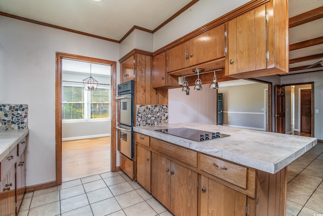 kitchen with backsplash, black electric stovetop, light tile patterned floors, ornamental molding, and stainless steel double oven