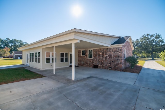 view of property exterior with a carport