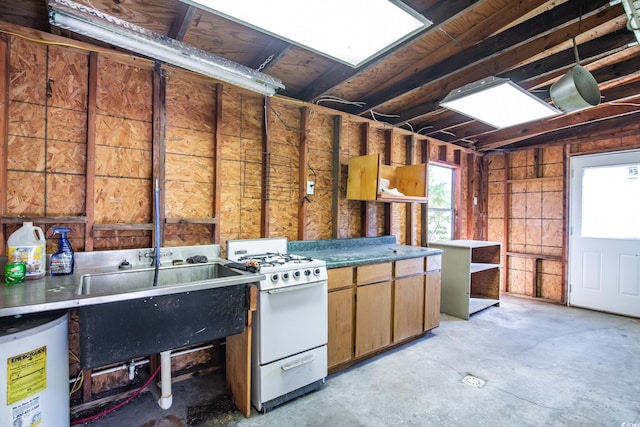 kitchen featuring white range with gas stovetop and gas water heater