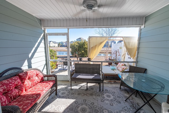 sunroom with a water view and a healthy amount of sunlight