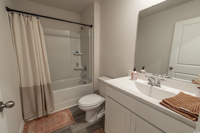 full bathroom featuring shower / bath combo, vanity, hardwood / wood-style flooring, and toilet