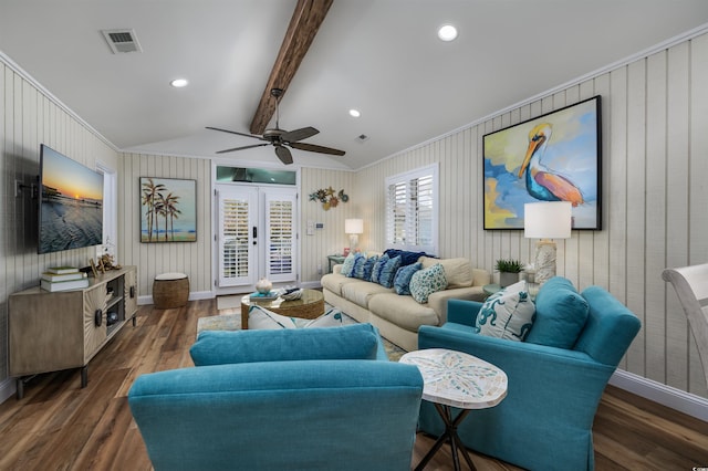 living room with french doors, ornamental molding, ceiling fan, dark wood-type flooring, and beamed ceiling