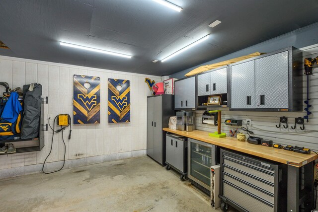 interior space with a workshop area and beverage cooler