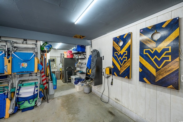 garage with stainless steel refrigerator