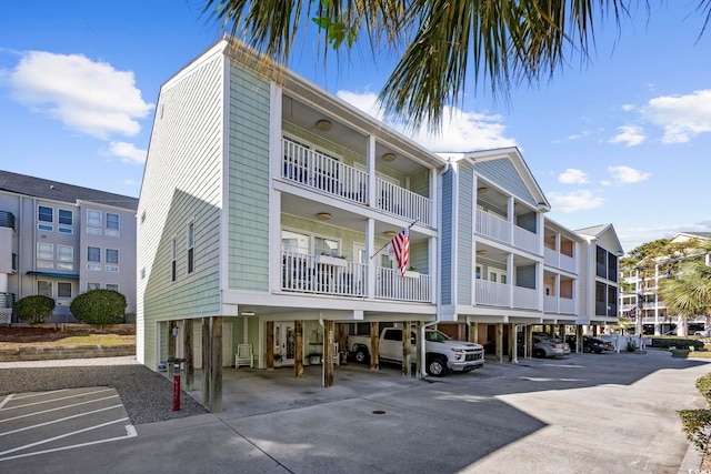 209 N Hillside Dr Unit 201, North Myrtle Beach, SC 29582 - view of property featuring parking