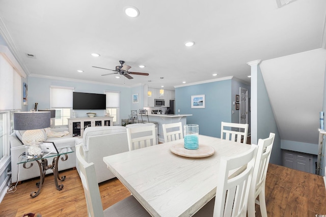 209 N Hillside Dr Unit 201, North Myrtle Beach, SC 29582 - dining area featuring ornamental molding, a ceiling fan, light wood-type flooring, and recessed lighting