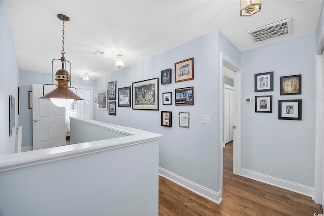 209 N Hillside Dr Unit 201, North Myrtle Beach, SC 29582 - hallway featuring baseboards and dark wood-style flooring
