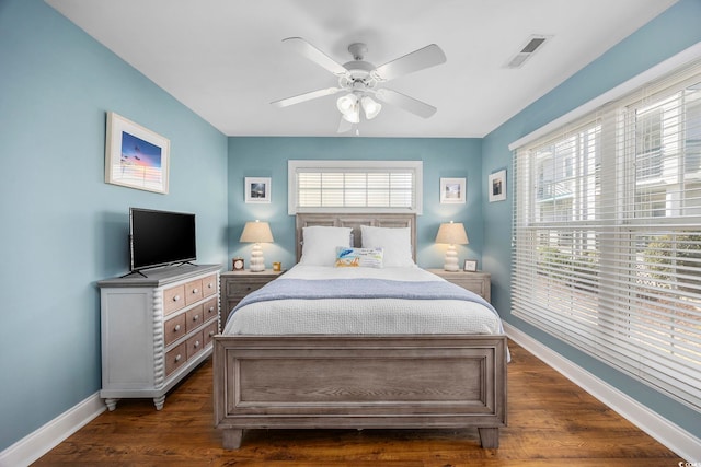 209 N Hillside Dr Unit 201, North Myrtle Beach, SC 29582 - bedroom with dark wood-style flooring and ceiling fan