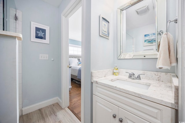 209 N Hillside Dr Unit 201, North Myrtle Beach, SC 29582 - ensuite bathroom featuring wood finished floors and vanity