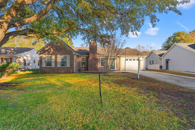 ranch-style home featuring a front yard and a garage