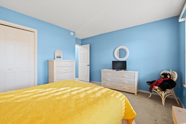 carpeted bedroom featuring a closet