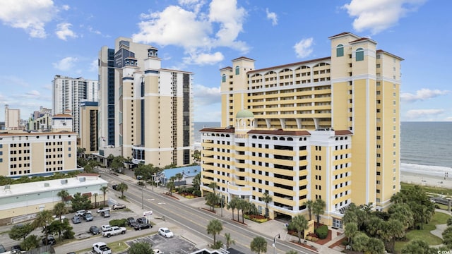 city view featuring a water view and a view of the beach