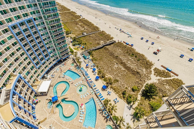 drone / aerial view featuring a view of the beach and a water view