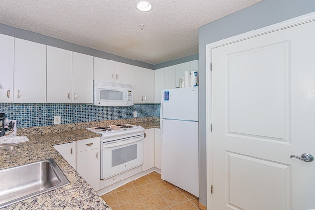 kitchen with white cabinetry, sink, backsplash, a textured ceiling, and white appliances