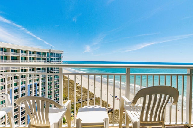 balcony with a view of the beach and a water view