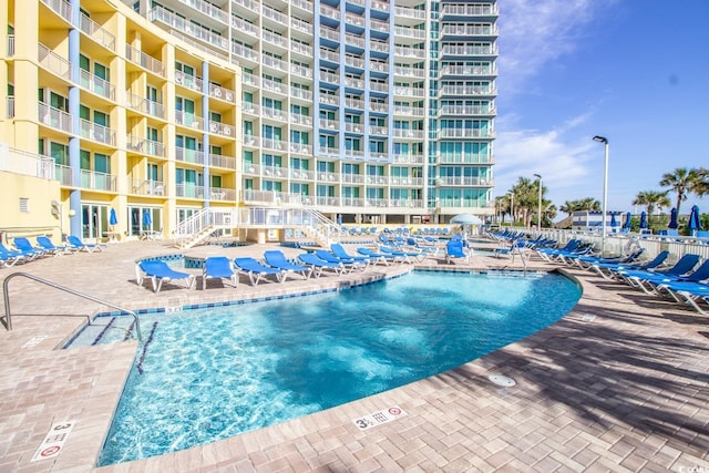 view of swimming pool featuring a patio area