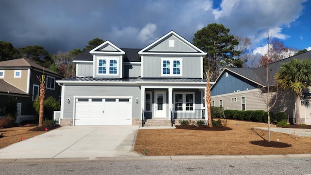 view of front of house with covered porch and a garage