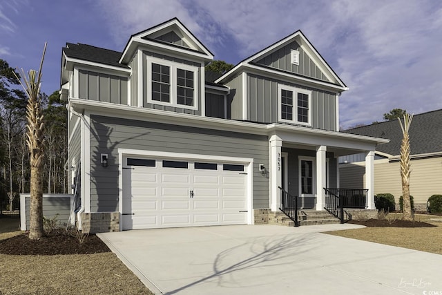 traditional-style house with concrete driveway, a porch, board and batten siding, and an attached garage