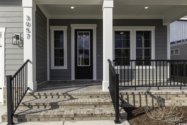 entrance to property featuring a porch