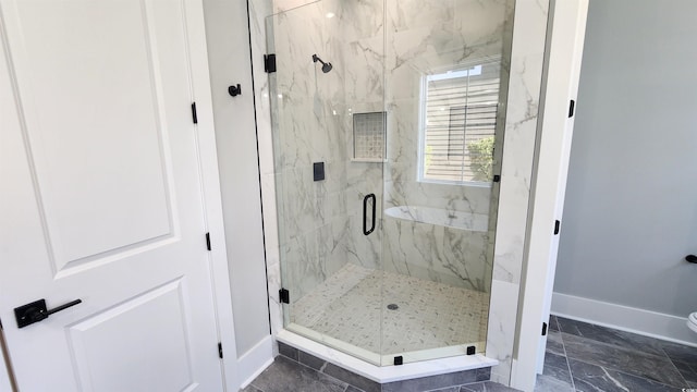 bathroom featuring an enclosed shower