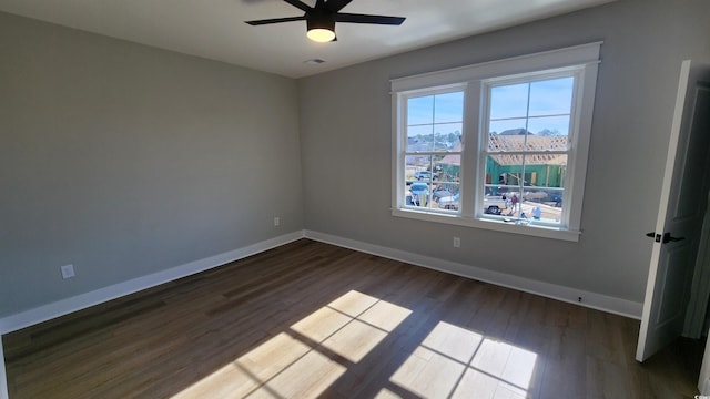 spare room featuring ceiling fan and wood-type flooring